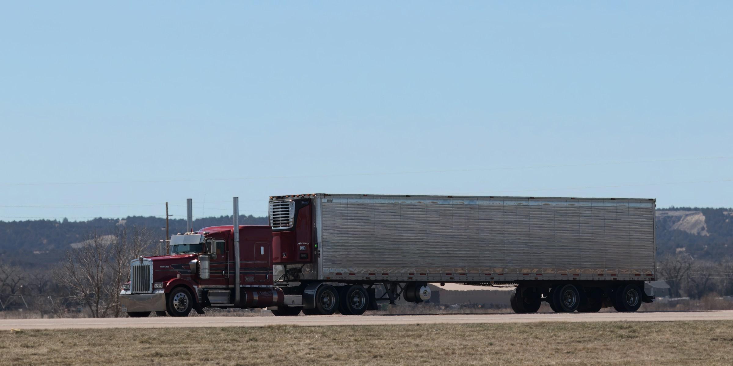 Modern semi-truck driving on an American highway